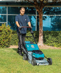 Pro Grade 21 Inch Cordless Self Propelled Lawn Mower steps up your yard game in a grassy area with a man operating it.