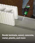 Person applying Hi-Strength 90 Permanent Spray Adhesive, Inverted Can for Upside-Down Spraying on concrete surface