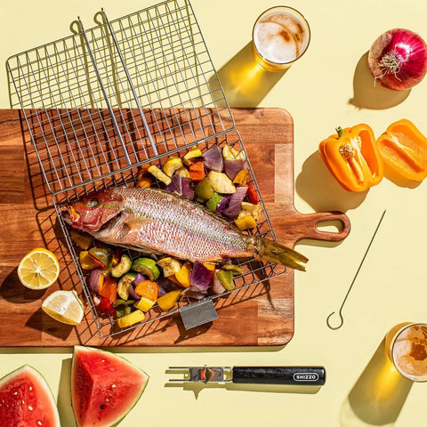 Grill Basket Set For Barbecue Lovers holding fish and vegetables on a wooden board with lemon and skewers nearby.