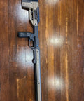 Oryx Sportsman Tika T1X SA Right Hand Chassis System Black Rifle Stock With Custom Length Of Pull Accessory on wood floor