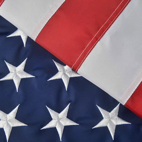 Close-up of Patriotic 2x3 Ft USA Flag Crafted From Oxford Polyester with vivid colors, sewn stripes, embroidered stars.