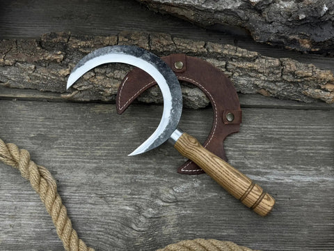 Hand Forged Athame Crescent Blade Sickle For Ritual Work And Herb Harvesting A Versatile Witchy Tool on wood