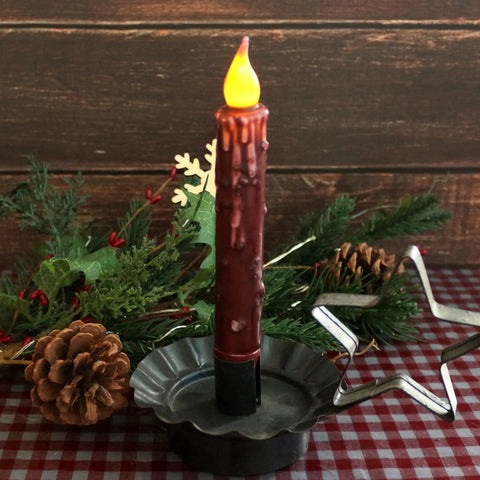 Real Wax Hand Dipped Battery Operated LED Taper Candles Burgundy Six And Three Quarters Inch Flameless Rustic Primitive Decor Six Pack With Timers Cozy Vibe Ambient Glow For Tables Mantels And Vases in decorative holder with greenery