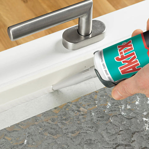 Applying White Silicone Caulk Sealant For Kitchen And Bath 100 Percent Waterproof RTV Gap Filler Ultra Flexible And No Yellowing on door