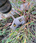 Three In One Garden Tool Tiller Weed Remover Hole Digger Drill Attachment For Drills in action on garden weeds