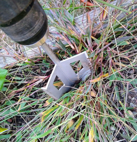 Three In One Garden Tool Tiller Weed Remover Hole Digger Drill Attachment For Drills in action on garden weeds