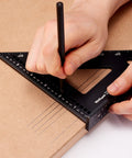 Person using a 150mm CNC Aluminum Triangle Square for rafter and framing layout precise 90 degree marking on wood surface.