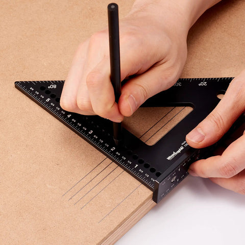 Person using a 150mm CNC Aluminum Triangle Square for rafter and framing layout precise 90 degree marking on wood surface.