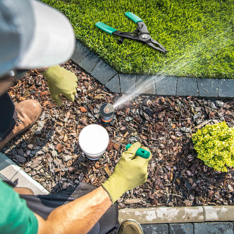 Person using Sprinkler Head Tool Set for Rain Bird Irrigation Systems, Pull Up and Rotor Adjustment Tools on lawn sprinkler