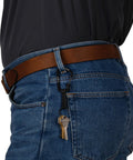 Person wearing SlideLock Aluminum Locking Carabiner Key Ring With Nylon Strap on belt loop holding keys securely, black