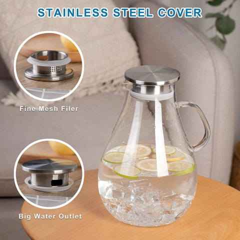Premium Borosilicate Glass Pitcher With Lid 3000ml Hot And Cold Water Jug For Juices And Iced Tea Beverages Lead Free Eco Friendly Durable Carafe For Family Hangouts And Everyday Use displayed with stainless steel cover and infuser on a table.