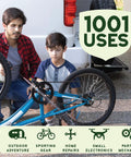 Father and son repairing a bicycle wheel with Multipurpose Lubricant And Degreaser For Garage Doors Hinges And Locks Plant Based Eco Friendly Petroleum Free PTFE Free Rust Remover And Degreaser For DIY Friendly Hardware Maintenance 11 Oz Pack Of 6 nearby, outdoor setting, "1001 Uses" shown.
