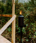 Two Pack 65 Inch Metal Black And Orange Outdoor Torches With Easy Install Lever for patio lawn garden weather resistant lighting