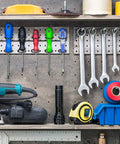 Pegboard Screwdriver And Tool Holder Rack Set With Six Ring Style Hooks For Pliers And Small Tools, Quick Clip On Mount, Durable Black Finish, Keeps Your Garage Neat And Gear Close At Hand shown installed on a wall with tools.