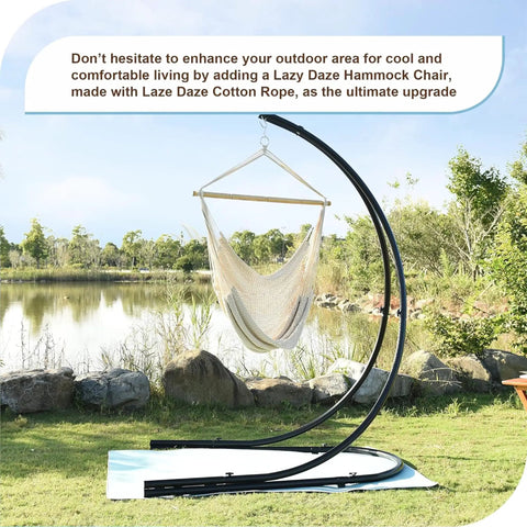 Caribbean Hammock Chair With 40-Inch Hardwood Spreader Bar And Soft-Spun Cotton Rope, displayed outdoors by a pond