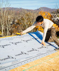 Top Shelf Synthetic Roof Underlayment Roll Covers 10 Squares Heavy Duty Waterproof Barrier used by contractor on roof.