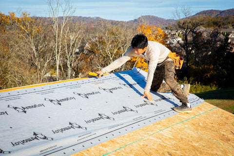 Top Shelf Synthetic Roof Underlayment Roll Covers 10 Squares Heavy Duty Waterproof Barrier used by contractor on roof.