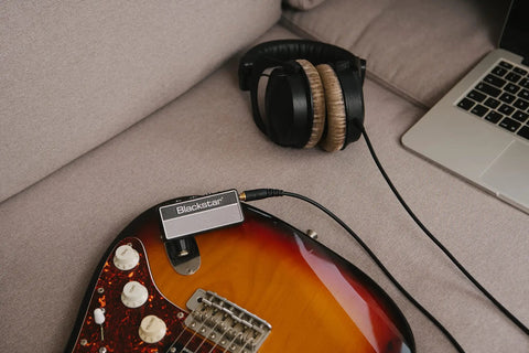 Compact Electric Guitar Headphone Amplifier With Full Analog Circuitry Clean Crunch And Lead Channels ISF Tone Control Nine Built-In Effects Including Chorus And Delay Portable Practice Studio For Quiet Jamming On The Go connected to guitar