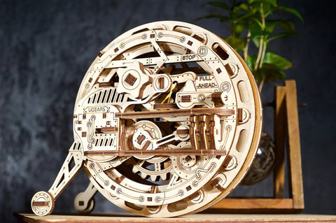 Mechanical Wooden 3D Puzzle Model Monowheel Construction Set For Gearhead Builders With A Steampunk Skeleton Showcasing Moving Dope Gears Durable Outdoor Ready So You Can Roll It On The Street Or Desk A Fun STEM Toy. Laser-cut wood monowheel, 185 x 95 x 160 mm.