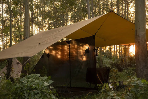 Bulwark Camping Tarp Rain Fly 12.8 Ft By 9.5 Ft Tough As Nails Ultra Waterproof 210T Polyester Shelter set up in forest
