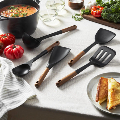 Silicone Wood Handle 5-Piece Cooking Utensil Set With BPA-Free Matte Black Silicone Includes 2-In-1 Spatula on table with food