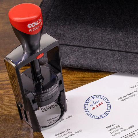 Rock Solid Heavy Duty Self Inking Date And Time Stamp With Custom Text Message and Crisp Black Ink on paperwork.
