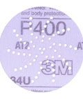 Front view of Cubitron II Hookit Clean Sanding Abrasive Disc 31465 with multi hole pattern for dust extraction, 3 inch 500+ grit.