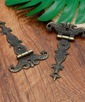 Beefy Heavy Duty Antique Bronze Tee Strap Hinge Set for barn doors, vintage style on wooden background, zinc alloy construction