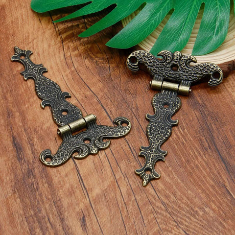 Beefy Heavy Duty Antique Bronze Tee Strap Hinge Set for barn doors, vintage style on wooden background, zinc alloy construction