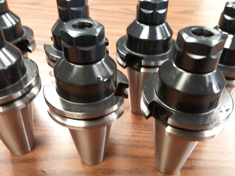 CAT40 ER16 Collet Chucks 8 Piece Heavy Duty Set For CNC Milling Machining Centers thick neck design on wood surface