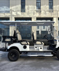 Rock Solid 6 Seater Electric Golf Cart With 48V Lithium Battery And 14 Inch Off Road Tires White profile view on pavement.