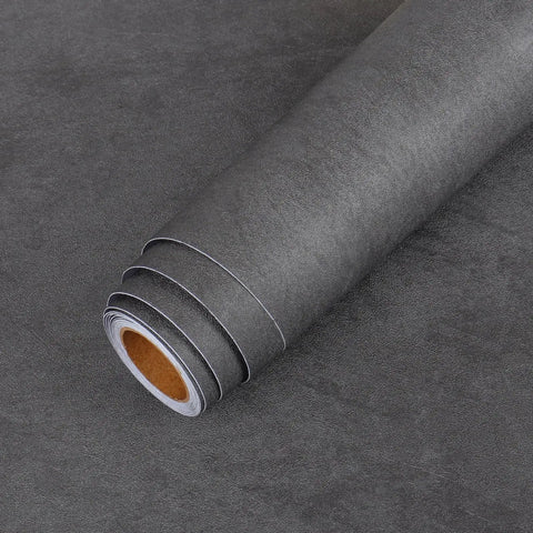 Extra Thick Matte Concrete Wallpaper Roll Peel And Stick Dark Grey Vinyl Contact Paper For Walls Furniture And Countertops DIY Friendly Durable Waterproof Bubble Free Easy Apply 12 By 317 Inches, rolled wallpaper on dark surface.