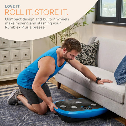 Man storing Rumblex Plus 4D Vibration Plate Exercise Machine With Whole Body Vibration under couch, showing compact design.