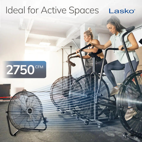 20 Inch Black High Velocity Wall Mount Fan With Pivoting Head used in a fitness space with exercise bikes, providing 2750 CFM airflow.