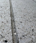 Close-up of sealed crack on concrete using Penetrating Siloxane PD Weather Seal For Concrete, Masonry, Stucco And Manufactured Stone