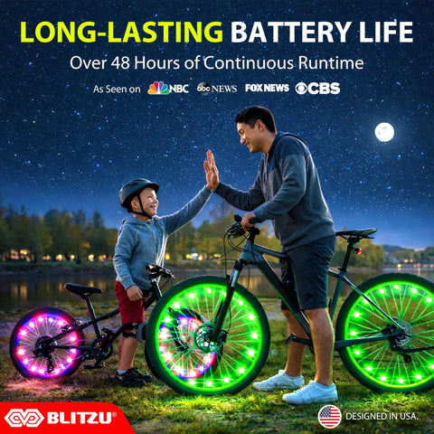 Father and son high five next to bikes with LED Bike Wheel Lights Set For Night Riding 2 Tire Pack With 7 Color Modes