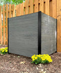 Two Panel Vinyl Outdoor Privacy Screen No Dig Kit For Concealing Trash Bins And AC Units Full Coverage Charcoal 3.5ft High By 3.5ft Wide Per Panel Each 43in H By 42in W shown beside a wooden fence with flowers