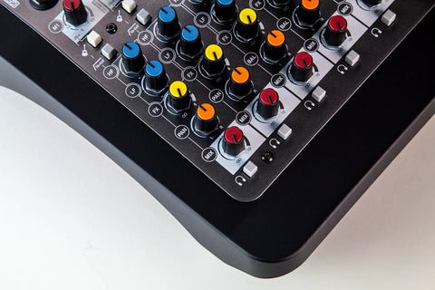 Close-up of Six Channel Compact Live Mixer with color-coded knobs and durable metal chassis, GS Pre preamps visible.