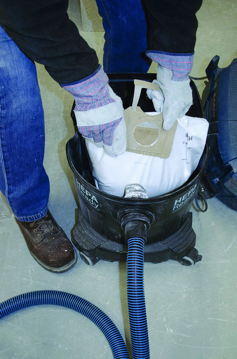 Person inserting Fleece Dust Bags For 9 Gallon Dust Extractors 30 Pack Heavy Duty Pre Filter Bags For Debris And Dust Compatible With Vac090 Series