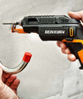 GEINXURN cordless impact driver side view with black and orange body driving screw into a metal wall hook