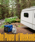 Dual Fuel 5000 Watt Portable Inverter Generator With Remote Start next to RV in forest setting, gas cylinder visible