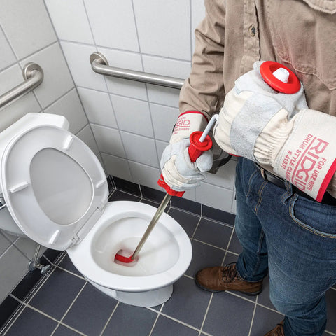 Heavy Duty Toilet Auger With Bulb Head Snake And Pro Clog Remover For Modern Low Flow Toilets in action, clearing a toilet.