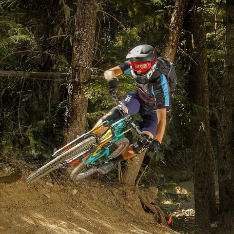 Mountain biker on trail with Flat Bar MTB Stem Mount For A Clean Cockpit One Accessory At A Time Mount A Computer Camera Or Light On
