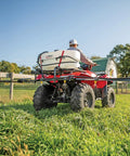 ATV Sprayer With 25 Gallon Tank, 2.4 GPM Flow, 60 PSI, Folding 7 Nozzle Boom, UV-Resistant Plastic Tank in use on a farm