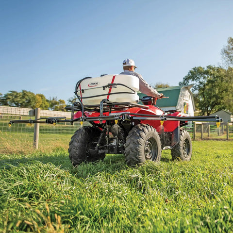 ATV Sprayer With 25 Gallon Tank, 2.4 GPM Flow, 60 PSI, Folding 7 Nozzle Boom, UV-Resistant Plastic Tank in use on a farm