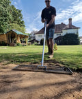 Man using 38 Inch Wide Leveling Lawn Rake With Stainless Steel Head And 72 Inch Aluminum Handle Top Notch Heavy Duty Yard Leveler