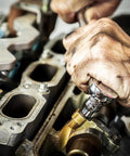 Mechanic using 176 Piece Socket Set With 1/4 3/8 And 1/2 Inch Drives 12 Point Standard And Deep SAE And Metric Sockets Off Corner Loading on engine