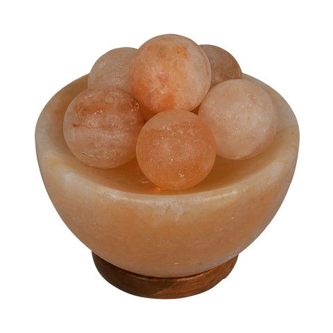 Fire Bowl Salt Lamp With Crystal Massage Balls Handcrafted From Pakistan, calming glow in a wooden bowl, amber hue.