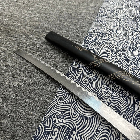 Dope Six Color Iaido Training Katana Set With 1060 Carbon Steel Blades, close-up of sword blade with dragon engravings on textiles.