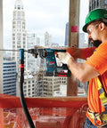 Construction worker using Workhorse SDS-Plus Bulldog Rotary Hammer Bit 1/4 Inch By 6 Inch with two cutter head on concrete wall.